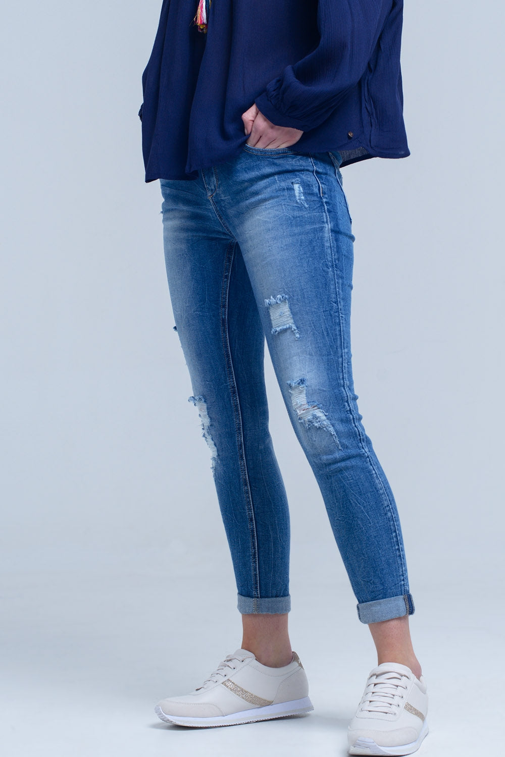 Jean skinny rasgado afligido