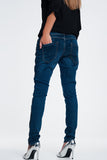 Jeans cravejados olhar de couro
