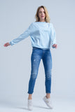 Jeans de tornozelo com rip e reparo