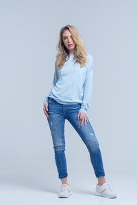 Jeans de tornozelo com rip e reparo