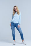 Jeans de tornozelo com rip e reparo