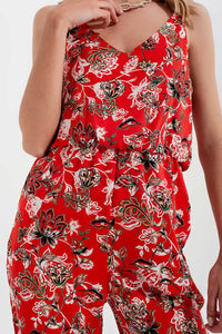 Macacão comprido com estampa floral e tiras finas em vermelho