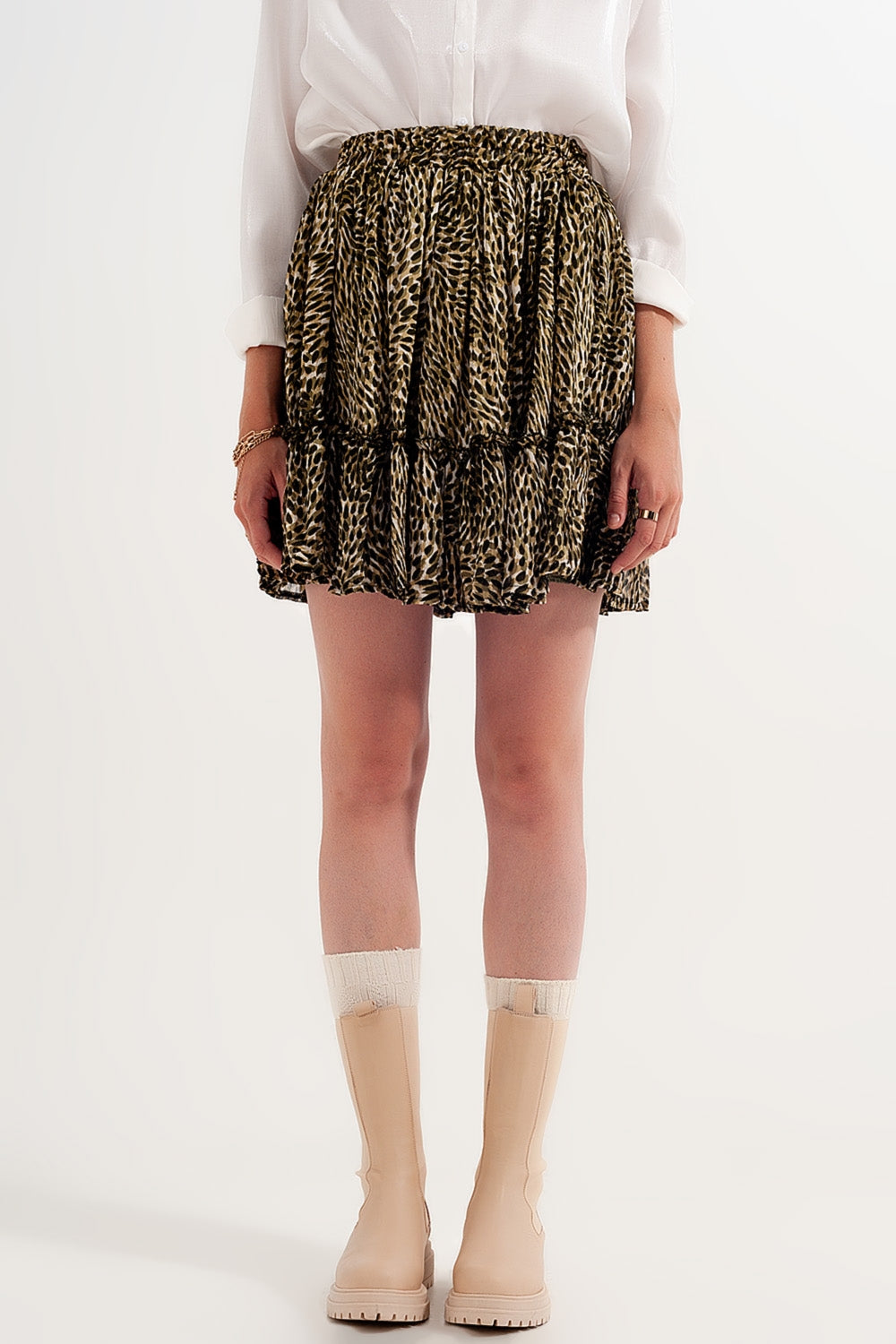 Mini-saia chiffon verde com cintura elástica e tecido brillante