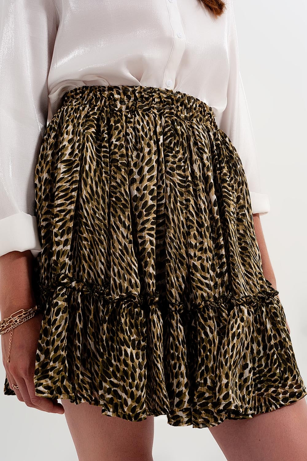 Mini-saia chiffon verde com cintura elástica e tecido brillante