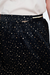 Minissaia preta com dobras e polka dot impressão