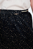 Minissaia preta com dobras e polka dot impressão