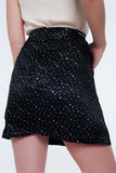 Minissaia preta com dobras e polka dot impressão