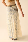 Saia longa de renda bege com design floral
