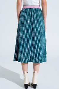 Saia maxi em verde com estampado de flores e fenda lateral