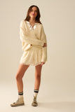 Shorts creme bordados com lantejoulas