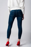 Skinny jeans cintura baixa em denim escuro