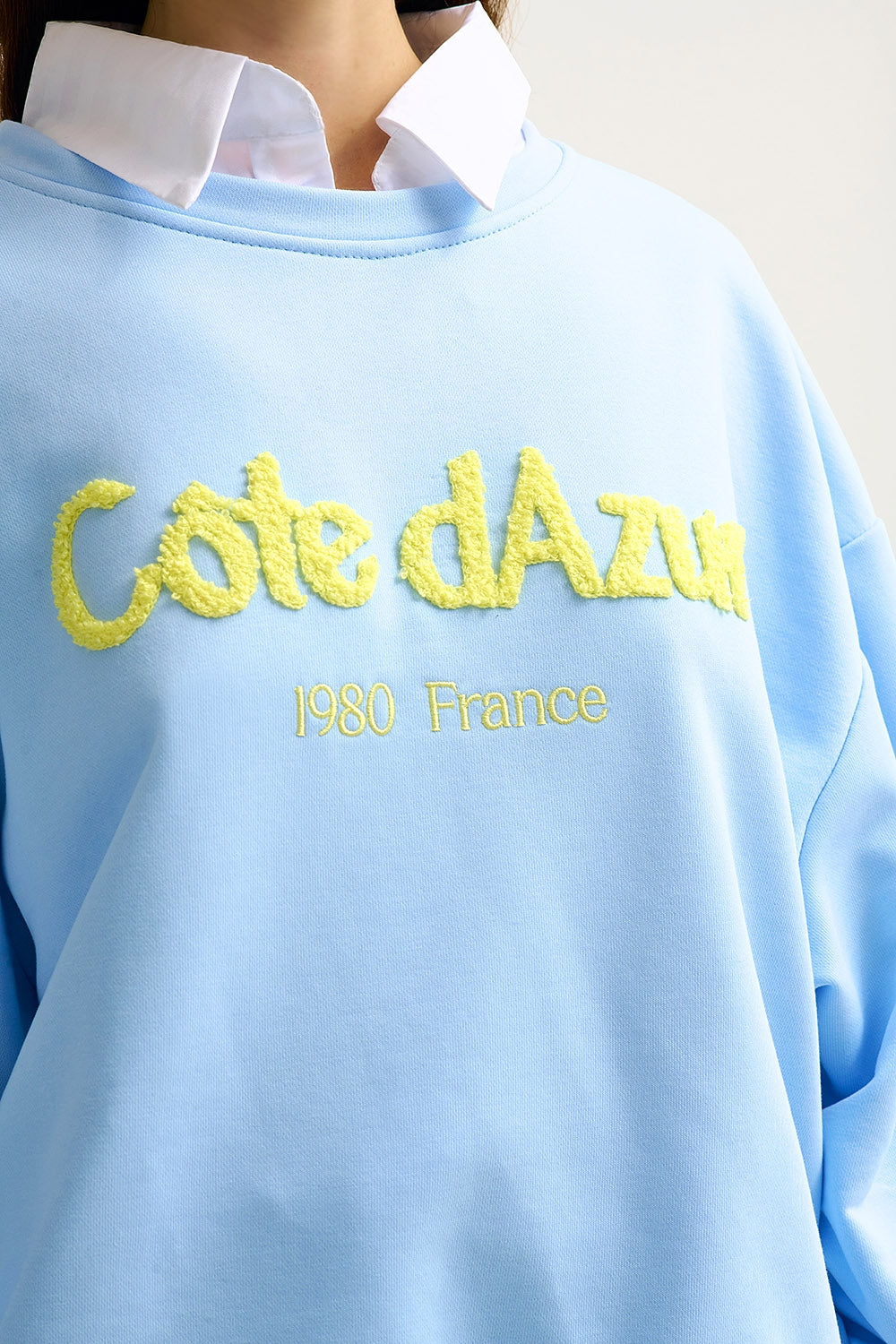 Sweatshirt azul pastel bordada Côte d'Azur