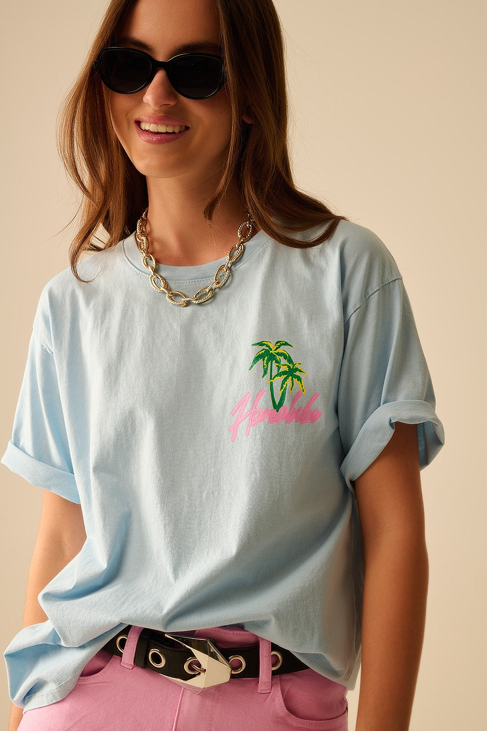 T-shirt azul fabricada em Itália com gráfico de Honolulu