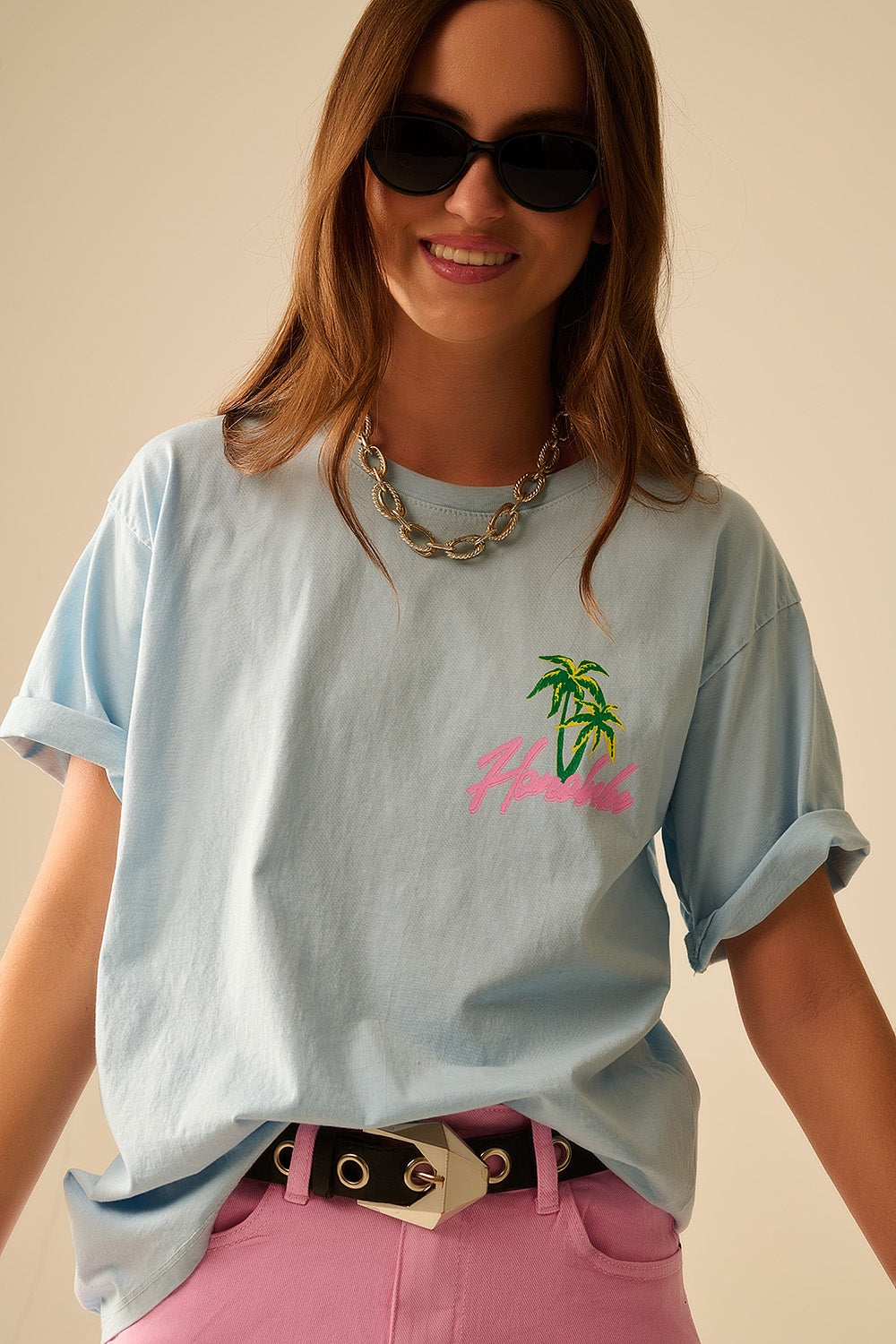 T-shirt azul fabricada em Itália com gráfico de Honolulu