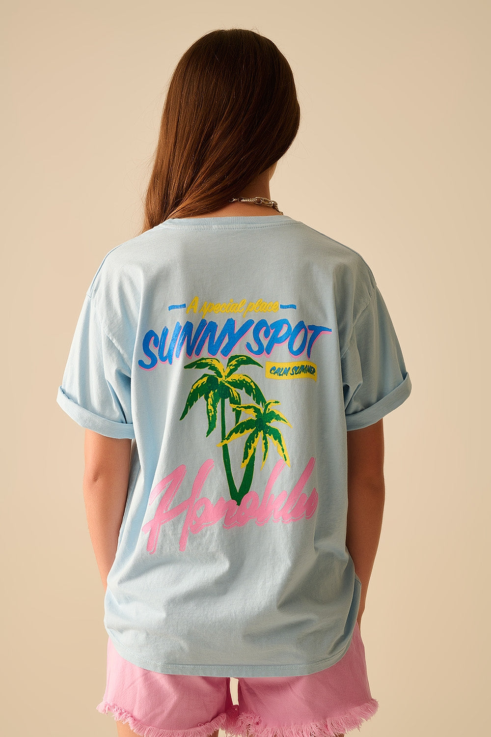 T-shirt azul fabricada em Itália com gráfico de Honolulu