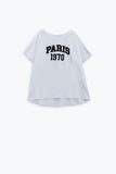 T-shirt branca de grandes dimensões com a inscrição paris 1970 em preto