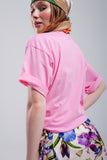 T shirt em cor de rosa com texto Beverly Hills