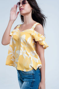 Top amarela da flor e detalhe dos plissados