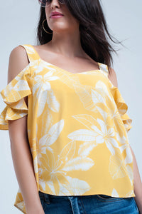 Top amarela da flor e detalhe dos plissados