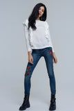 Top com detalhe de ruffle em creme