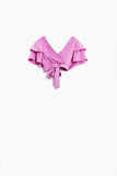 Top cor-de-rosa com mangas curtas e decote em V