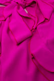 Top cor-de-rosa sem mangas com pormenores em folhos e gola alta