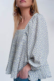 Top floral azul com decote quadrado e mangas insufláveis