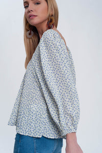 Top floral azul com decote quadrado e mangas insufláveis