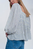 Top floral azul com decote quadrado e mangas insufláveis