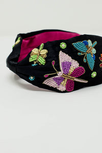 Diadema preta com borboletas e flores bordadas